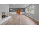 Open-concept living area featuring stylish wood floors and ample natural light at 305 W Old Rd, Lillington, NC 27546