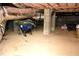 Unfinished basement with exposed insulation and utility equipment at 3141 Wagoner Ln # 09, Graham, NC 27253