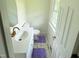 Bathroom featuring a modern sink, toilet, and stylish purple rugs at 3141 Wagoner Ln # 09, Graham, NC 27253
