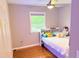 Cozy bedroom with a comfortable bed and natural light from the window at 3141 Wagoner Ln # 09, Graham, NC 27253