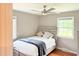 Bedroom with a queen bed, ample natural light, and modern ceiling fan at 3141 Wagoner Ln # 09, Graham, NC 27253