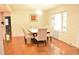 Bright dining room featuring hardwood floors, a modern chandelier, and large windows for natural light at 3141 Wagoner Ln # 09, Graham, NC 27253