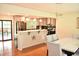 A modern eat-in kitchen with an island, stainless steel appliances, and lots of natural light at 3141 Wagoner Ln # 09, Graham, NC 27253