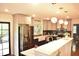 A beautifully renovated kitchen with stainless steel appliances, an island, and pendant lighting at 3141 Wagoner Ln # 09, Graham, NC 27253