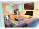 Comfortable living room with a large sectional sofa, fireplace, and natural light at 3141 Wagoner Ln # 09, Graham, NC 27253