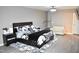 Spacious main bedroom with a king bed, sitting area, and neutral decor at 3141 Wagoner Ln # 09, Graham, NC 27253