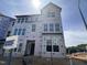 New construction home with large windows awaiting finishing touches and landscaping at 331 Chesapeake Cmns St # 106, Garner, NC 27529