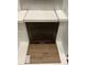 Interior design choices featuring dark wood cabinet, white countertop, and wood look flooring at 331 Chesapeake Cmns St # 106, Garner, NC 27529
