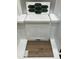 Interior design choices featuring dark green hexagon tiles, white countertop, and wood look flooring at 331 Chesapeake Cmns St # 106, Garner, NC 27529
