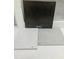 Interior design choices featuring dark wood cabinet, white countertop, and light gray tiling at 331 Chesapeake Cmns St # 106, Garner, NC 27529
