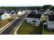 Aerial view of new homes in the Betterra neighborhood, Clayton, NC, with sidewalks and lush landscaping at 3313 Brunot St, New Hill, NC 27562