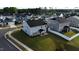 Aerial view of a well-manicured lawn and backyard of a new home in Betterra neighborhood, Clayton, NC at 3313 Brunot St, New Hill, NC 27562