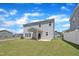 Stunning home exterior featuring a covered patio and a lush green lawn, perfect for enjoying the outdoors at 3313 Brunot St, New Hill, NC 27562
