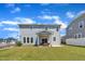 Beautiful home exterior with a covered patio and a well-maintained lawn, ideal for outdoor activities at 3313 Brunot St, New Hill, NC 27562