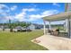 Spacious backyard with a covered patio, perfect for outdoor gatherings and enjoying the scenery at 3313 Brunot St, New Hill, NC 27562