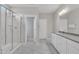 Bright bathroom featuring a vanity sink, tile shower, and toilet with glass door at 3313 Brunot St, New Hill, NC 27562