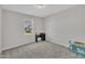 Well-lit bedroom featuring carpeted floors, a window, a desk and a table with chairs at 3313 Brunot St, New Hill, NC 27562
