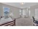 Cozy bedroom with neutral walls, plush carpeting, and two windows offering plenty of natural light at 3313 Brunot St, New Hill, NC 27562