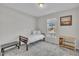 Neutral bedroom featuring a twin bed, window, carpet, and matching furniture at 3313 Brunot St, New Hill, NC 27562
