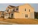Charming two-story home with neutral siding, dark shutters, and a well-manicured lawn at 3313 Brunot St, New Hill, NC 27562