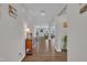 Inviting foyer featuring hardwood floors, neutral walls, decorative lighting, and a glimpse into the open living spaces at 3313 Brunot St, New Hill, NC 27562