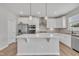 Contemporary kitchen with stainless steel appliances, a center island, and white cabinets at 3313 Brunot St, New Hill, NC 27562