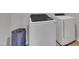 Modern laundry room featuring a Samsung washer and dryer set and a blue laundry basket at 3313 Brunot St, New Hill, NC 27562
