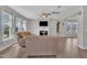 Relaxing living room filled with natural light, a ceiling fan, and hardwood floors at 3313 Brunot St, New Hill, NC 27562