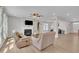 Bright living room with a fireplace, hardwood floors, and comfortable seating area at 3313 Brunot St, New Hill, NC 27562