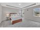 Spacious main bedroom featuring natural lighting, and tray ceiling at 3313 Brunot St, New Hill, NC 27562