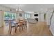Open floorplan featuring a dining table that flows into a comfortable living room with fireplace at 3313 Brunot St, New Hill, NC 27562