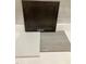 Interior material selection showing a dark cabinet door, white countertop, and stone look flooring at 351 Chesapeake Cmns St # 111, Garner, NC 27529
