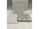 Bathroom tile selection includes decorative floor tile, neutral wall tile, and cabinet door sample at 351 Chesapeake Cmns St # 111, Garner, NC 27529