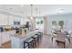 Modern kitchen featuring granite countertops, stainless steel appliances, and a large island at 366 Bunker Hill Place, Angier, NC 27501
