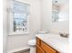 Bathroom featuring a single sink vanity, neutral walls, a large window, and tile floors at 3713 Phillips W Way, Durham, NC 27713