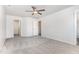Bedroom featuring neutral walls, plush carpeting, ceiling fan, and access to a closet and an attached bathroom at 3713 Phillips W Way, Durham, NC 27713