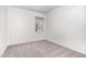 Bright bedroom features neutral carpet, a window with natural light, and fresh paint at 3713 Phillips W Way, Durham, NC 27713