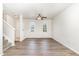 Bright living room featuring hardwood floors, a ceiling fan, and natural light from several windows at 3713 Phillips W Way, Durham, NC 27713