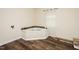 Bathroom featuring a jacuzzi tub and wood flooring at 3714 Mt Zion Church Rd, Mebane, NC 27302