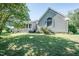 Side view of a house with a covered porch, a large window, and mature trees at 3714 Mt Zion Church Rd, Mebane, NC 27302