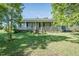 Charming single-story home with a welcoming front porch and well-maintained lawn at 3714 Mt Zion Church Rd, Mebane, NC 27302