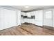 Bright kitchen with white cabinets, stainless steel appliances, and modern countertops at 3714 Mt Zion Church Rd, Mebane, NC 27302