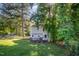View of backyard featuring a wooden deck with lush greenery offering an outdoor retreat at 40 Crepe Myrtle Ct, Angier, NC 27501