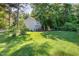 Well-maintained backyard featuring a wooden deck and lush greenery, creating a serene outdoor oasis at 40 Crepe Myrtle Ct, Angier, NC 27501