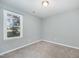 Well-lit bedroom with large window, neutral walls, and soft carpeting at 40 Crepe Myrtle Ct, Angier, NC 27501