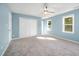 Bedroom with neutral walls, a ceiling fan, plush carpeting, and a double closet for storage at 40 Crepe Myrtle Ct, Angier, NC 27501