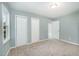 Bedroom with plush carpet, neutral walls, double closets, and access to en-suite bathroom at 40 Crepe Myrtle Ct, Angier, NC 27501