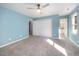 Carpeted bedroom features ceiling fan, double closets, and attached bathroom providing comfortable living at 40 Crepe Myrtle Ct, Angier, NC 27501