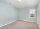 Bedroom featuring neutral walls, a window, and soft carpet at 40 Crepe Myrtle Ct, Angier, NC 27501