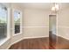 Bright dining room features beautiful dark wood floors, modern lighting, and neutral wall colors at 40 Crepe Myrtle Ct, Angier, NC 27501